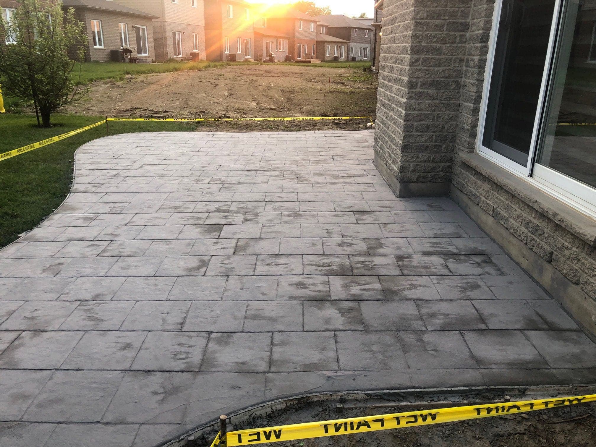Freshly sealed stamped concrete patio in London, Ontario by TriCity Concrete Sealing