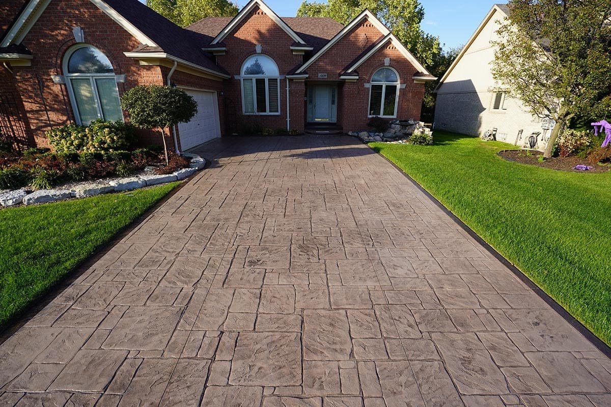 Stamped concrete driveway in front of a brick home in Southwestern Ontario
